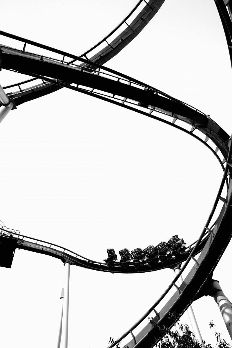 roller coaster roller coaster during daytime amusement park